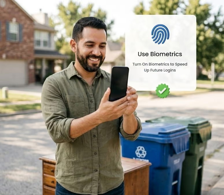 Resident using biometric login on a phone beside waste collection carts